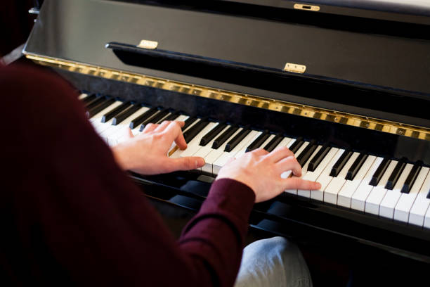 young man playing classic piano - allegro imagens e fotografias de stock