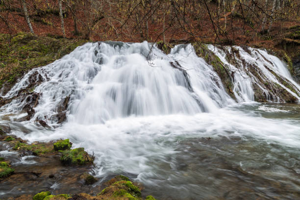 istock Waterfall abounding in water in the spring, slow motion 918423248