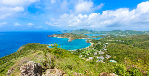 View of English Harbor from Shirley Heights, Antigua, paradise bay at tropical island in the Caribbean Sea View of English Harbor from Shirley Heights, Antigua, paradise bay at tropical island in the Caribbean Sea - travel destination for vacation falmouth harbor stock pictures, royalty-free photos & images