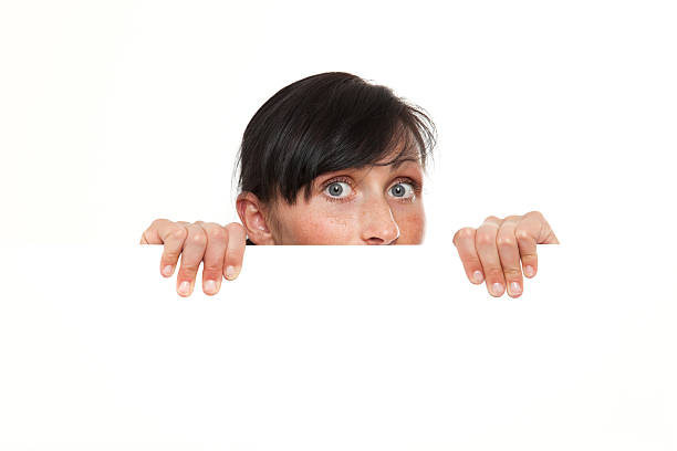 istock Inquisitive woman looking from blank copy-space card 91842453