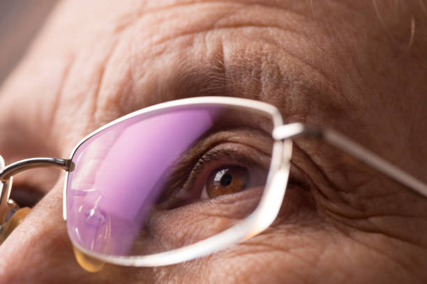 Close up mature woman eye wearing glasses.