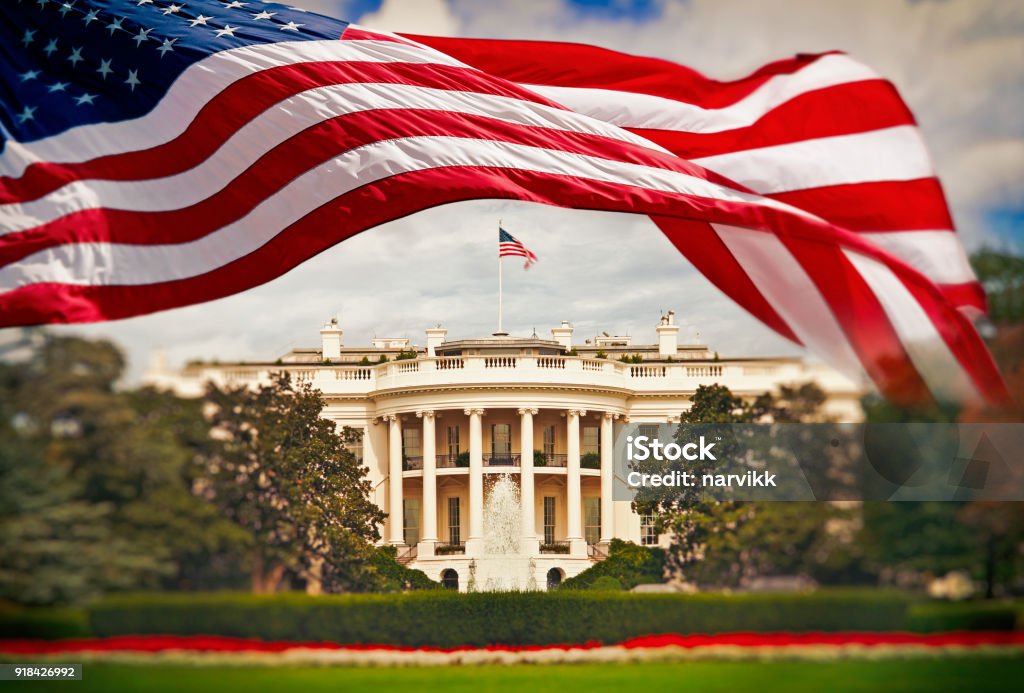 The White House with waving American flag The White House in Washington DC with waving United States flag White House - Washington DC Stock Photo