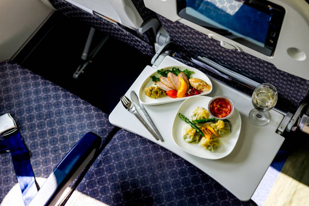 Tasty meal served on board of airplane on the table Tasty meal served on board of airplane on the table airplane food stock pictures, royalty-free photos & images