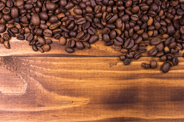 istock Roasted coffee beans on wooden background 918430670
