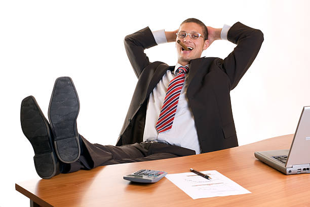 Manager relax with cigar in office stock photo