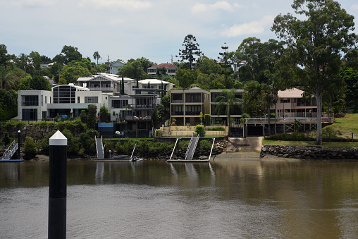 Upmarket houses and apartments on the banks of the Brisbane River at Yeronga, seen from Long Pocket