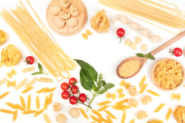 istock Overhead photo of different types of pasta on white, forming frame 918434276