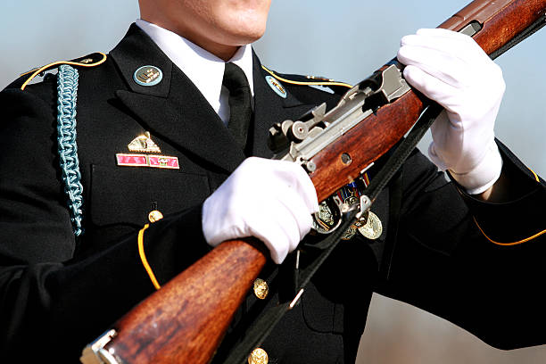 istock Honor guard in uniform holding a rifle 91843585