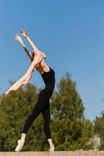 istock Ballerina dancing outdoors 918436882