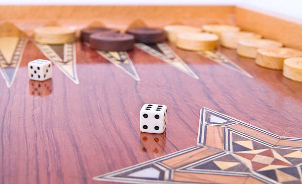 istock Ivory dices on wooden handmade backgammon board isolated 91843755