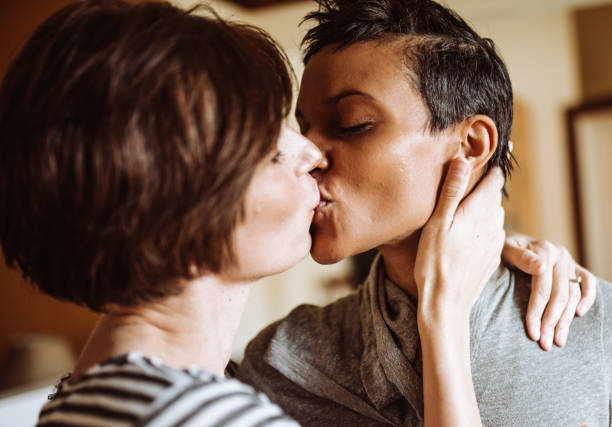 istock lesbian couple kissing togetherness 918440024