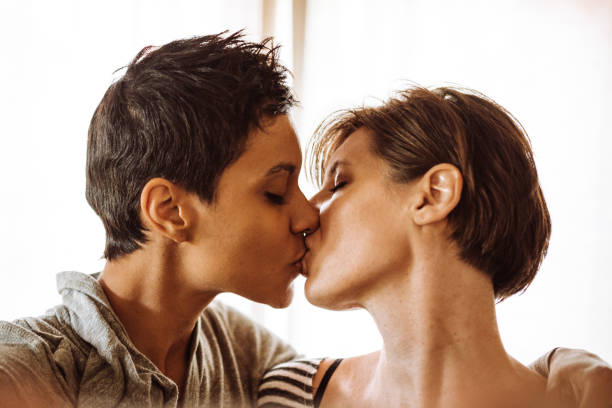 istock lesbian couple kissing togetherness 918440246