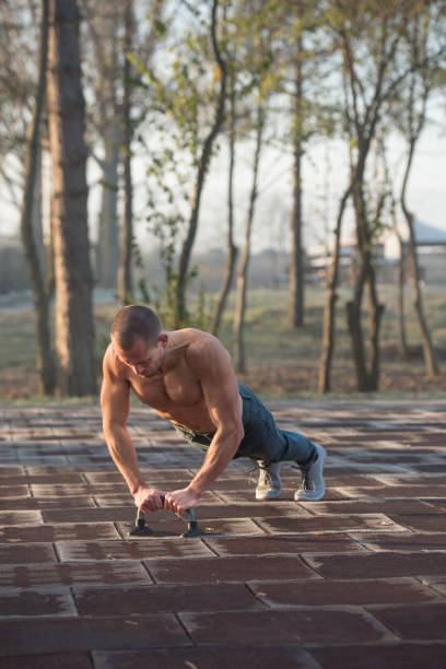 istock Man doing calisthenics workout outdoor 918440444