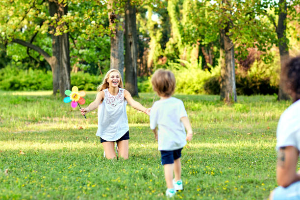 istock Happy family playing in the park 918440726