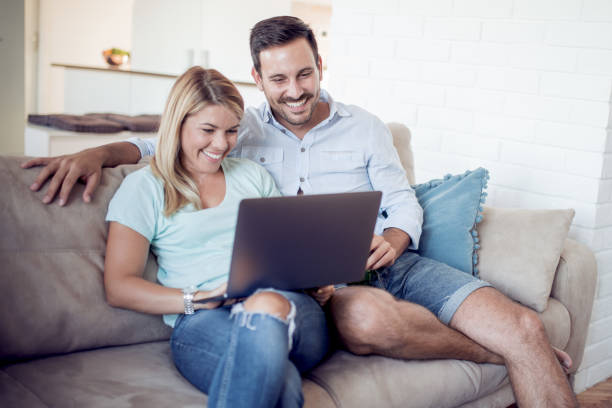istock Couple watching movie at home 918440782