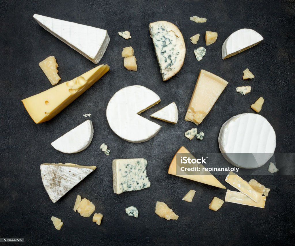 Various types of cheese - parmesan, brie, roquefort, cheddar Various types of cheese - parmesan, brie, roquefort, cheddar on concrete background or table Cheese Stock Photo