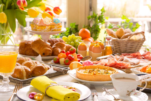 Table with delicatessen ready for Easter brunch Breakfast or brunch table filled with all sorts of delicious delicatessen ready for an Easter meal. cold cuts meat photos stock pictures, royalty-free photos & images