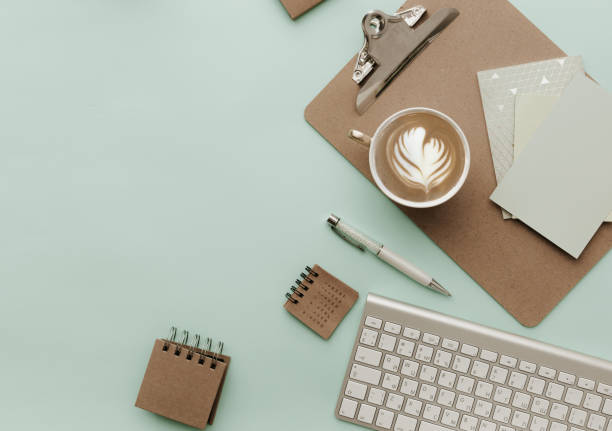 istock Home Pastel Office Desktop with eco craft elements , coffee cup and keyboard 918468500