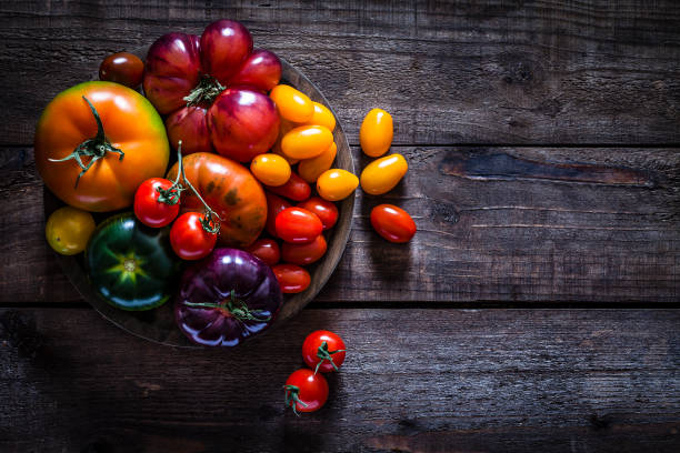 Collection of tomato varieties on rustic wooden table