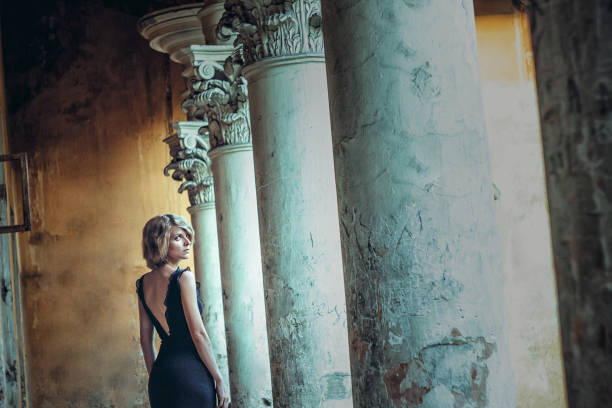 girl in black dress standing at the old Palace