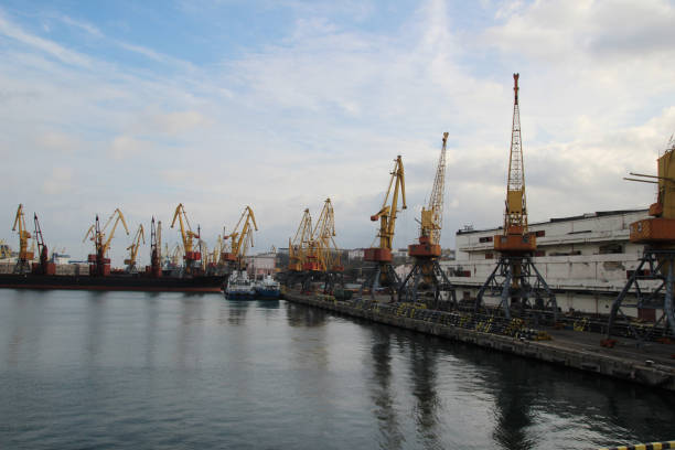 istock Logistics and transportation of Container Cargo ship and Cargo plane with working crane bridge in shipyard at Twilight sky, logistic import export background and transport industry. 918470378