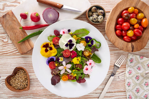 istock Edible flowers salad in a plate 918470786