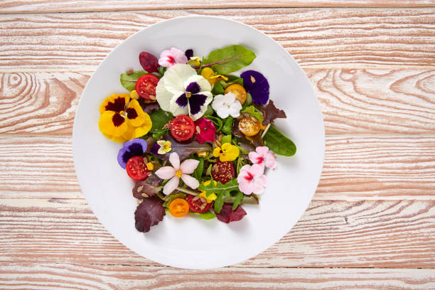 istock Edible flowers salad in a plate 918470830
