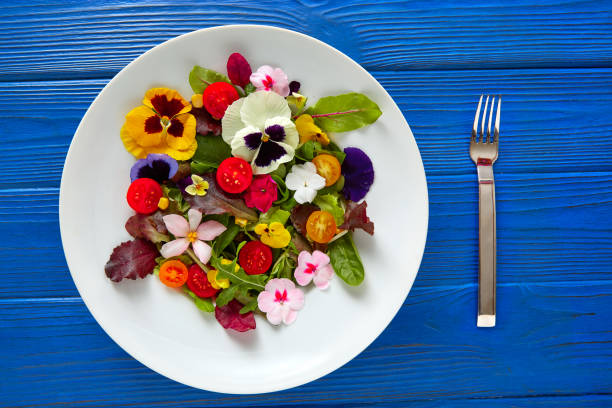 istock Edible flowers salad in a plate 918470956