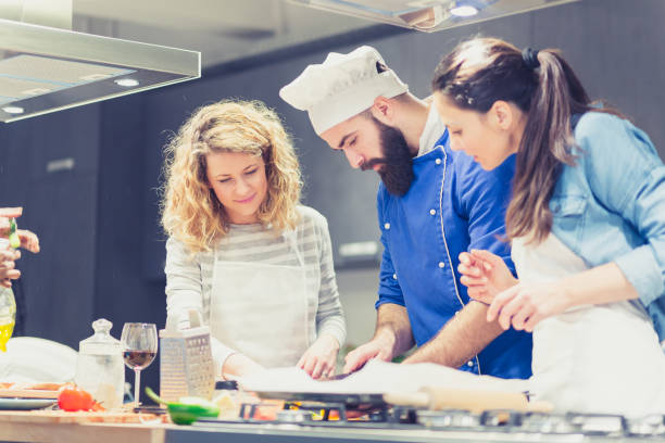 istock Cooking class participants enjoying cooking class 918473248