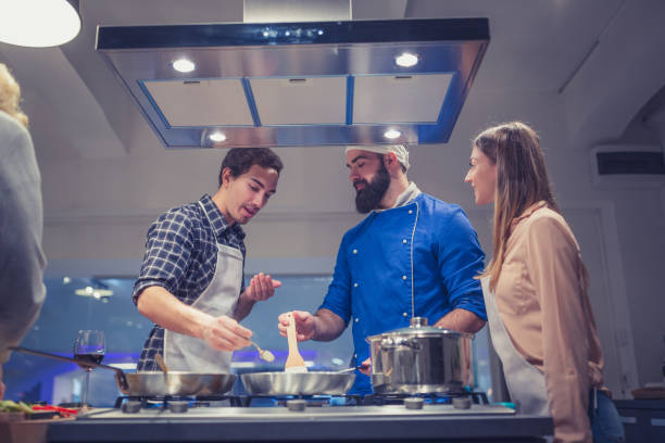 istock Young couple enjoying cooking class in kitchen 918473372