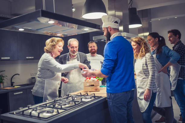 istock People in a cooking class enjoying their time 918473590