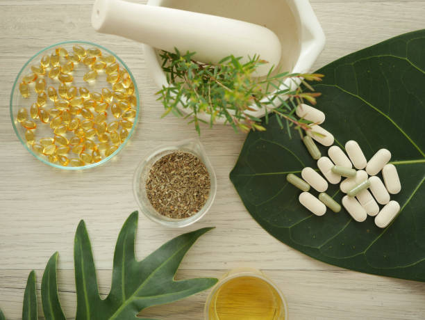istock alternative herb medicine. herbal vitamin on white background. 918474356