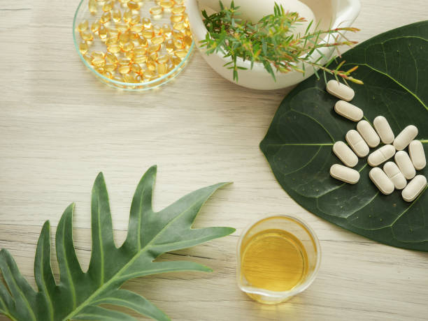 istock alternative herb medicine. herbal vitamin on white background. 918474464
