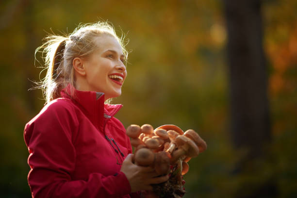 istock woman with mushrooms 918475072