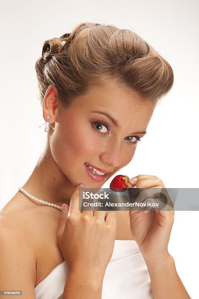 Portrait of beautiful bride with a strawberry.  XXXL  Adult Stock Photo