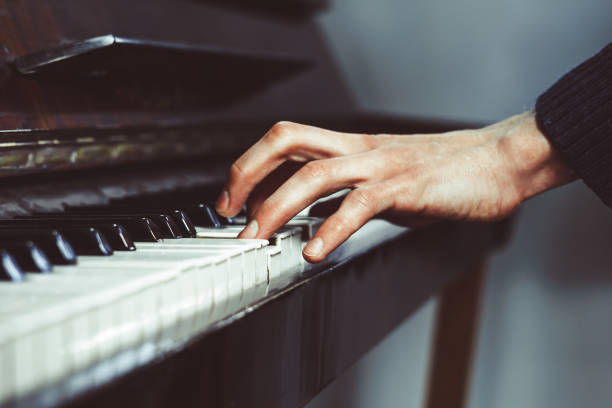 istock fingers on the piano 918481108