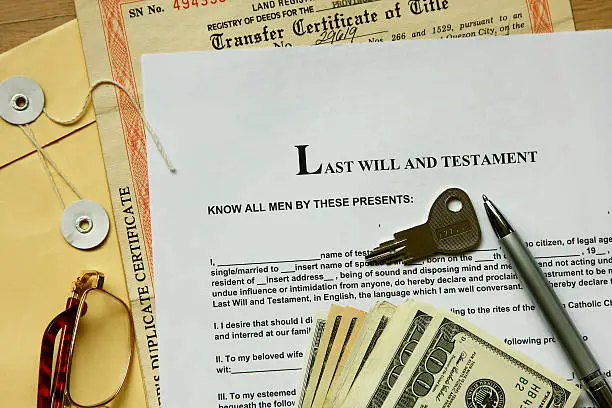 last will and testament with dollar , certificate and key.