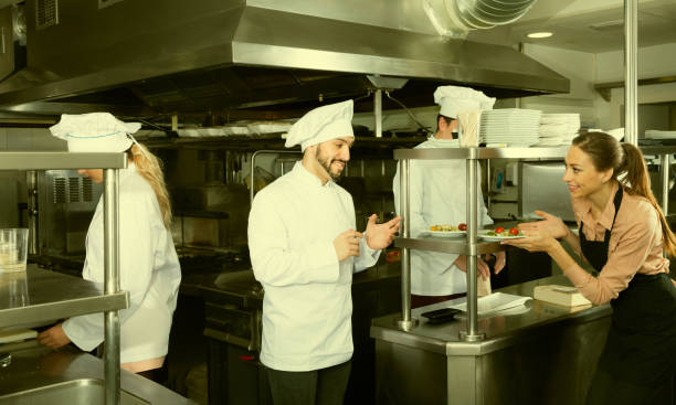istock Staff of restaurant with chef working together 918488778