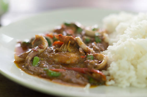 istock steamed rice with spicy fried sea food 918492308