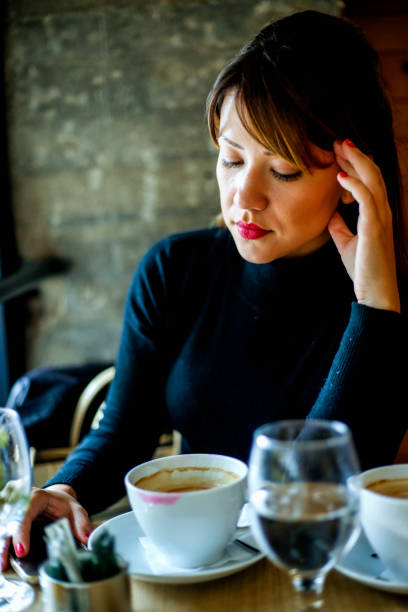 istock Young woman in a cafe drinking coffee 918492314
