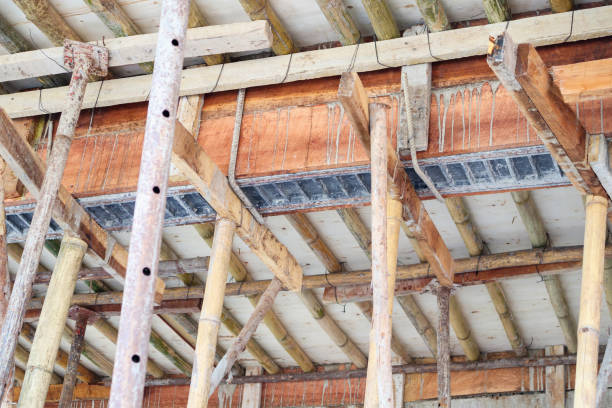 istock Bamboo scaffolding support concrete beam at house construction site 918492960