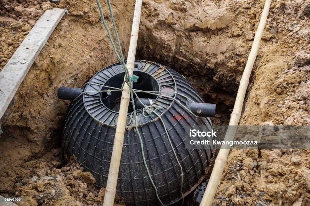 septic tank installation into the ground Poisonous Stock Photo