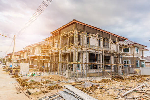 New house under construction at building site