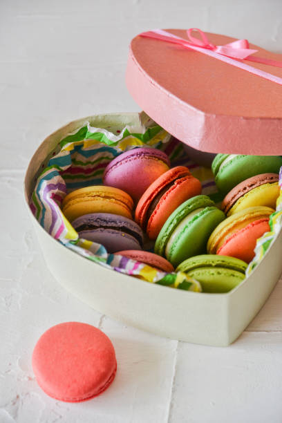 istock multicolored macaroons in a heart shaped gift box on a white background 918494116