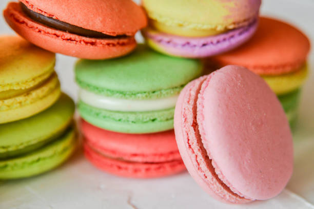 istock colorful macaroons in a gift box with a bright paper on a light background 918494132
