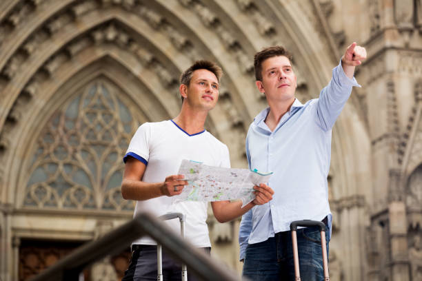 istock Male tourists with map and baggage 918494604
