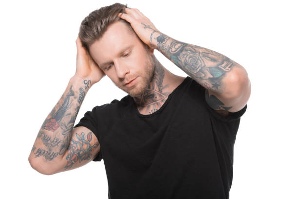 istock handsome tattooed man in casual clothes, isolated on white 918494974