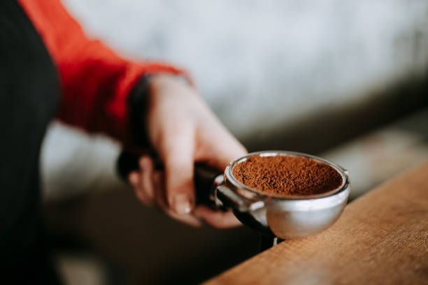 istock Barista is preparing making coffee with temper in hands 918496040