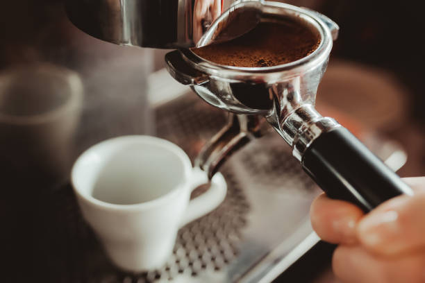 istock Prepare making hot coffee espresso in white glass cup at coffee machine 918497796