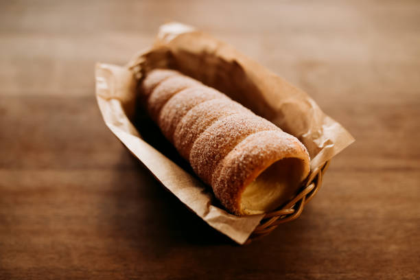 Baked trdelnik. Traditional czech food. Delicious bakery pastry food. Film look toned filter Baked trdelnik. Traditional czech food. Delicious bakery pastry food. Film look toned filter trdelník stock pictures, royalty-free photos & images